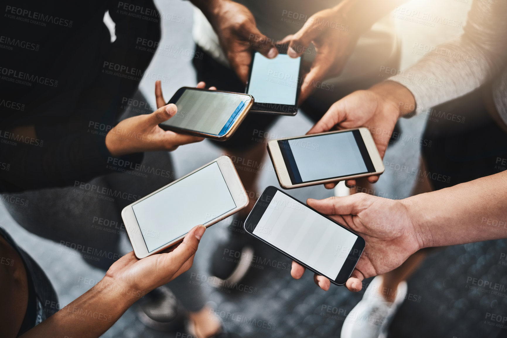 Buy stock photo Phone, mockup and hands of people in circle for networking on social media, mobile app or internet. Technology, contact and friends in group with cellphone for connectivity or notification on screen.