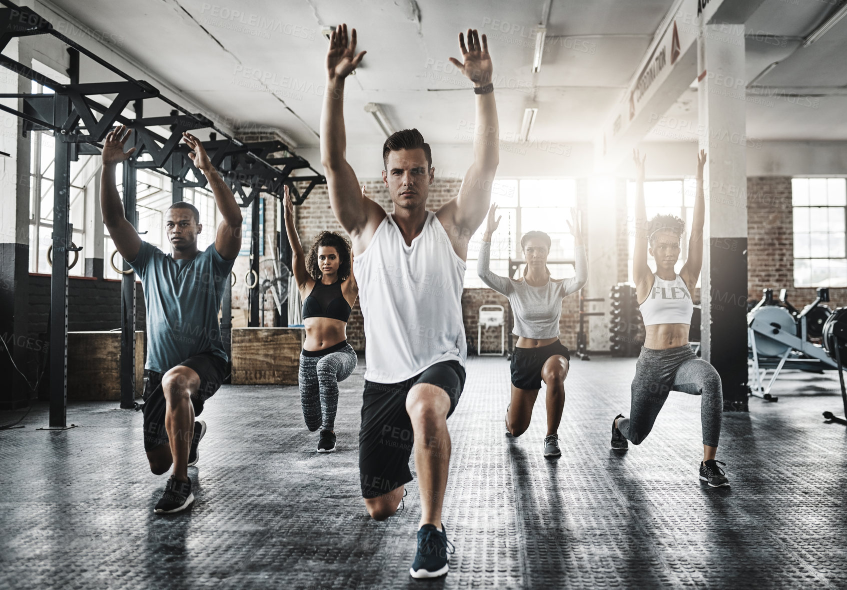 Buy stock photo Friends, exercise and lunge in group at gym for workout, core fitness or training together indoors. Diverse class, people or warm up for ab muscle, session and sport for health challenge in gymnasium