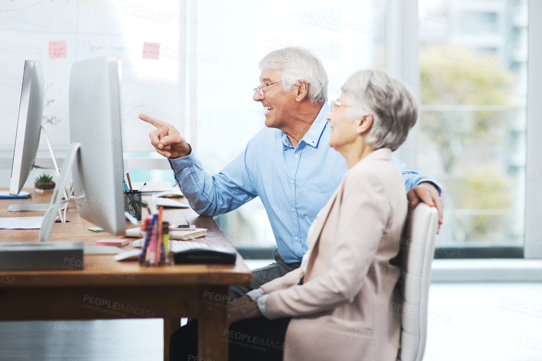 Buy stock photo Cropped shot of a senior couple working on their home finances in their study