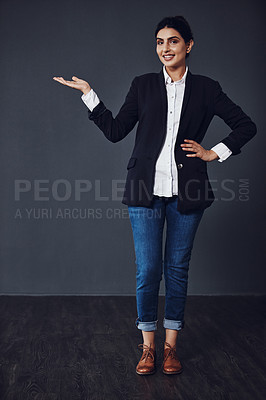 Buy stock photo Portrait, gesture and woman in studio for announcement, information or opportunity on dark background. Mockup, advice and hand of person for notification, teacher recruitment or registration