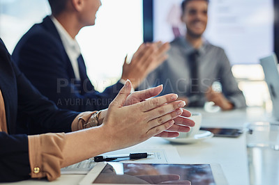 Buy stock photo Cropped shot of a group of businesspeople clapping during a meeting in a modern office