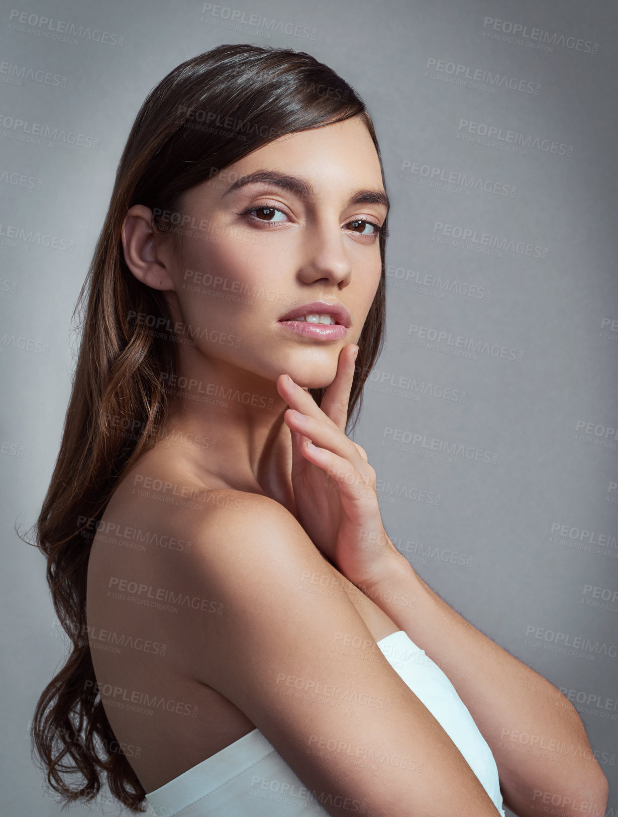 Buy stock photo Portrait, thinking and beauty of woman with glow, skincare or health isolated on gray studio background. Face, makeup and confident model in cosmetics at spa for dermatology, wellness and aesthetic