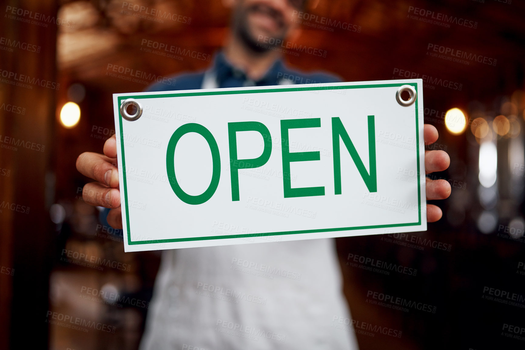 Buy stock photo Closeup of a unrecognizable business owner holding up a sign saying 