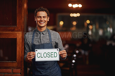 Buy stock photo Portrait of a cheerful young business owner holding up a sign saying 