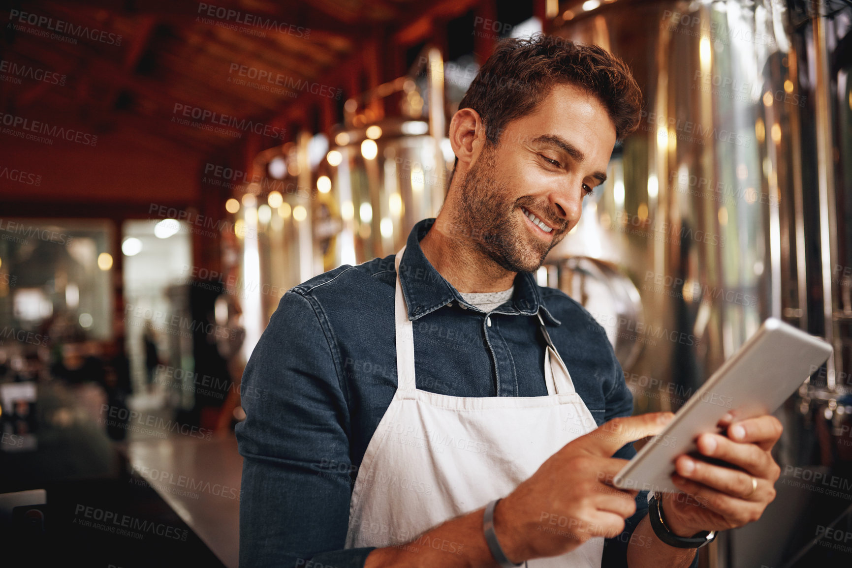 Buy stock photo Tablet, beer and smile with man in factory for production, manufacturing and alcohol fermentation. Technology, inspection and digital with business owner for distillery, storage and quality control