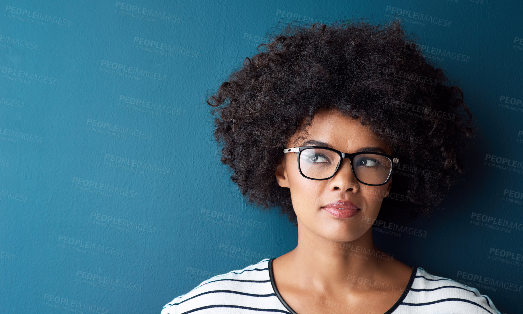 Buy stock photo Optometry, thinking and woman with spectacles in a studio with daydreaming, pensive or idea face expression. Optical, vision and African female model with glasses by blue background with mockup.