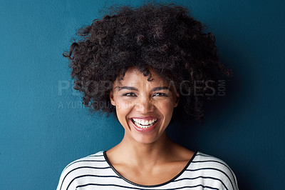 Buy stock photo Black woman, portrait and smile with funny, glow and confident on blue studio background. Girl, face and model with afro laughing for comic, joke and happiness or positive with natural beauty