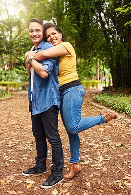 Buy stock photo Full length portrait of an affectionate young couple enjoying their day in the park