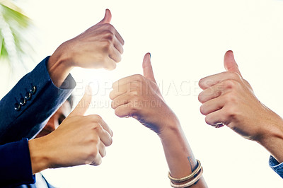 Buy stock photo Closeup shot of a group of unrecognizable businesspeople showing thumbs up together