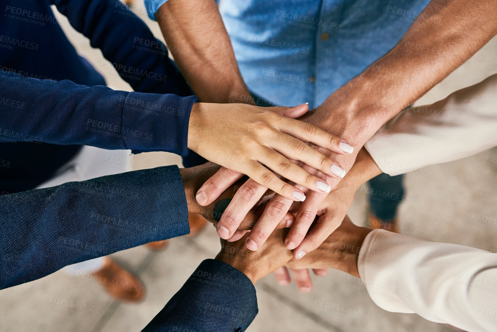 Buy stock photo Closeup shot of a group of people joining their hands in a huddle 