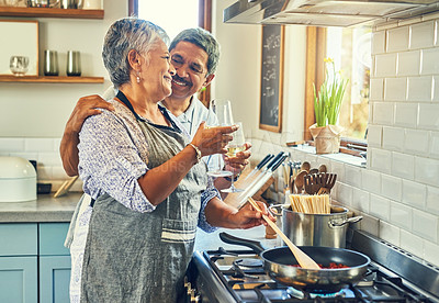 Buy stock photo Toast, wine and senior couple at stove cooking healthy food together in kitchen with smile, health and romance. Cheers, drinks and old woman with man, glass and happiness, meal in pan and retirement.