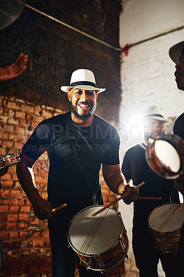 Buy stock photo Portrait of a young musical performer playing drums with his band