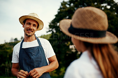Buy stock photo Cropped shot of a handsome man talking to his young daughter while working on their farm