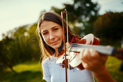 Buy stock photo Cropped shot of a young girl playing a violin outdoors