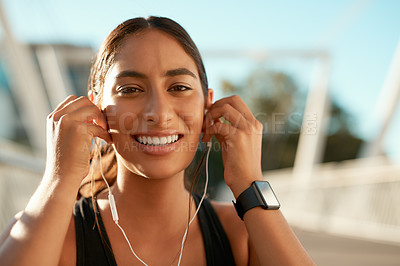 Buy stock photo Portrait, smile and woman in city for training break, road and fitness workout with wellness music audio. Podcast, runner and girl with earphones, streaming and urban cardio with athlete radio