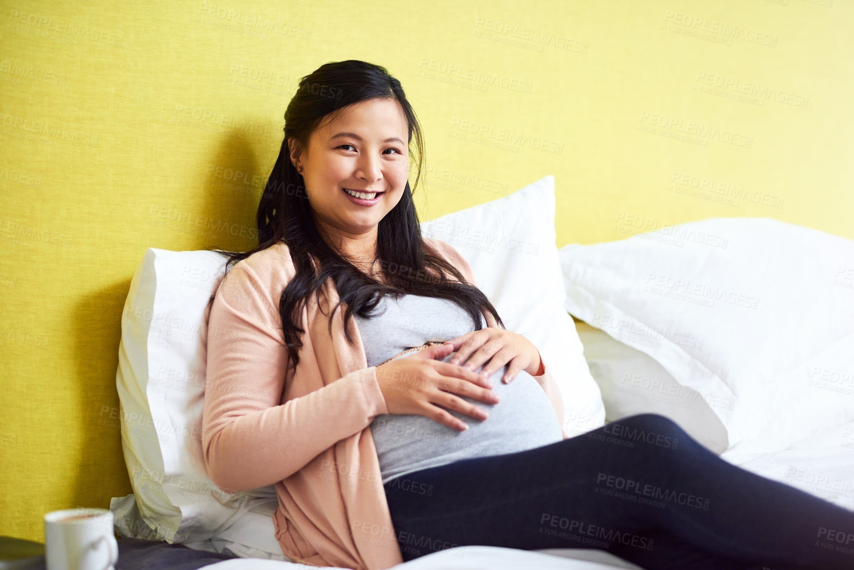 Buy stock photo Portrait of a pregnant woman relaxing at home