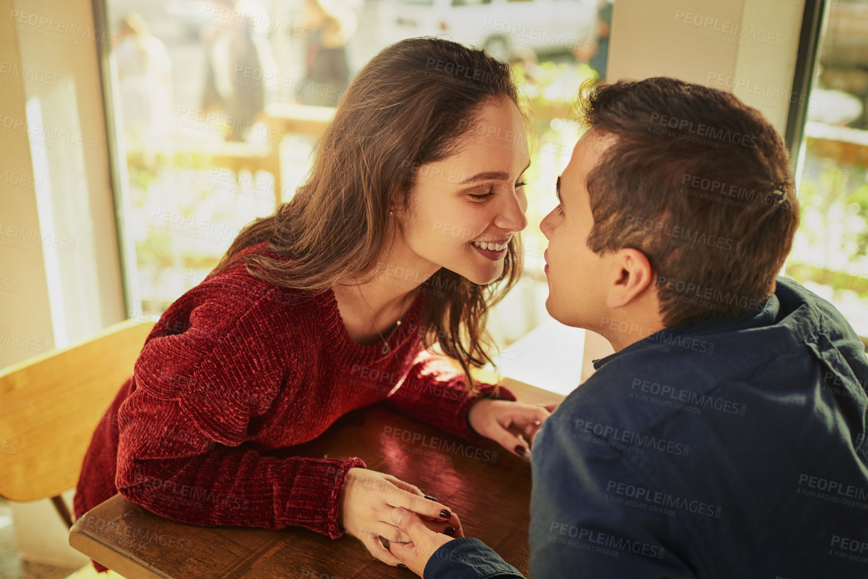 Buy stock photo Romance, coffee shop and couple holding hands with love on anniversary, date and empathy with care. Man, woman and trust with support, partnership and loyalty to commitment or travel for bonding