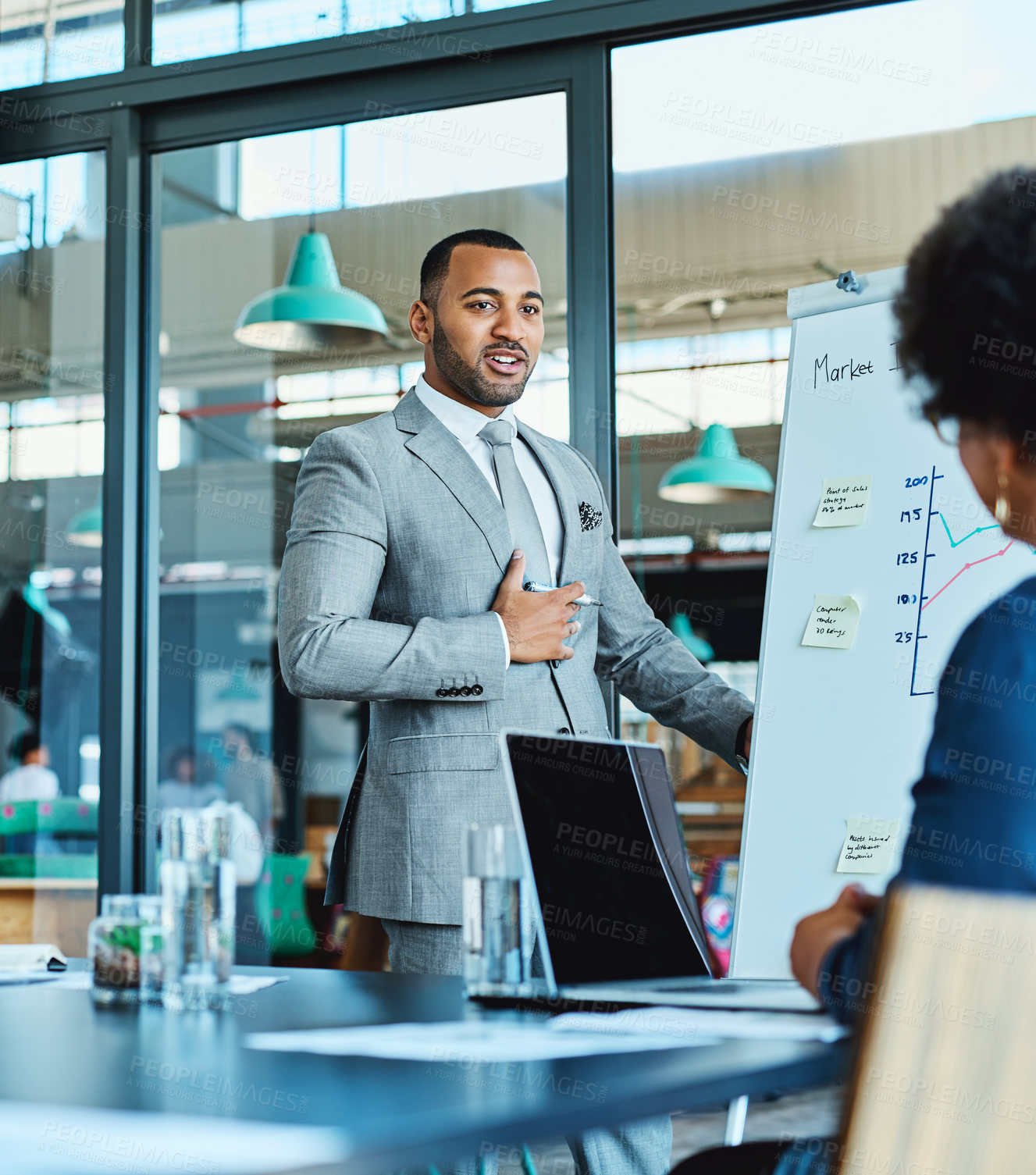 Buy stock photo Shot of a businessman giving a presentation to his colleagues in a boardroom