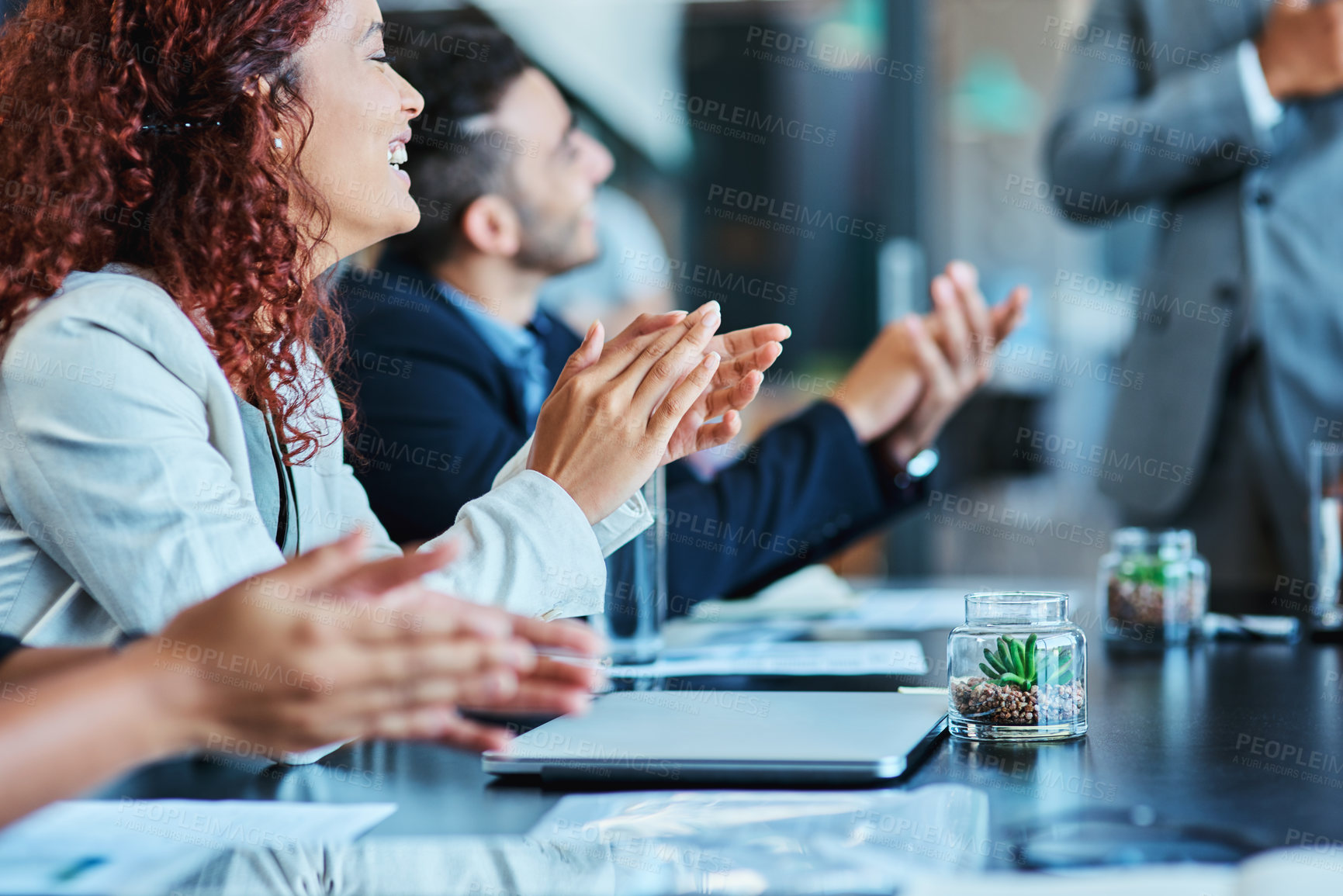 Buy stock photo Shot of a group of businesspeople applauding during a meeting in an office