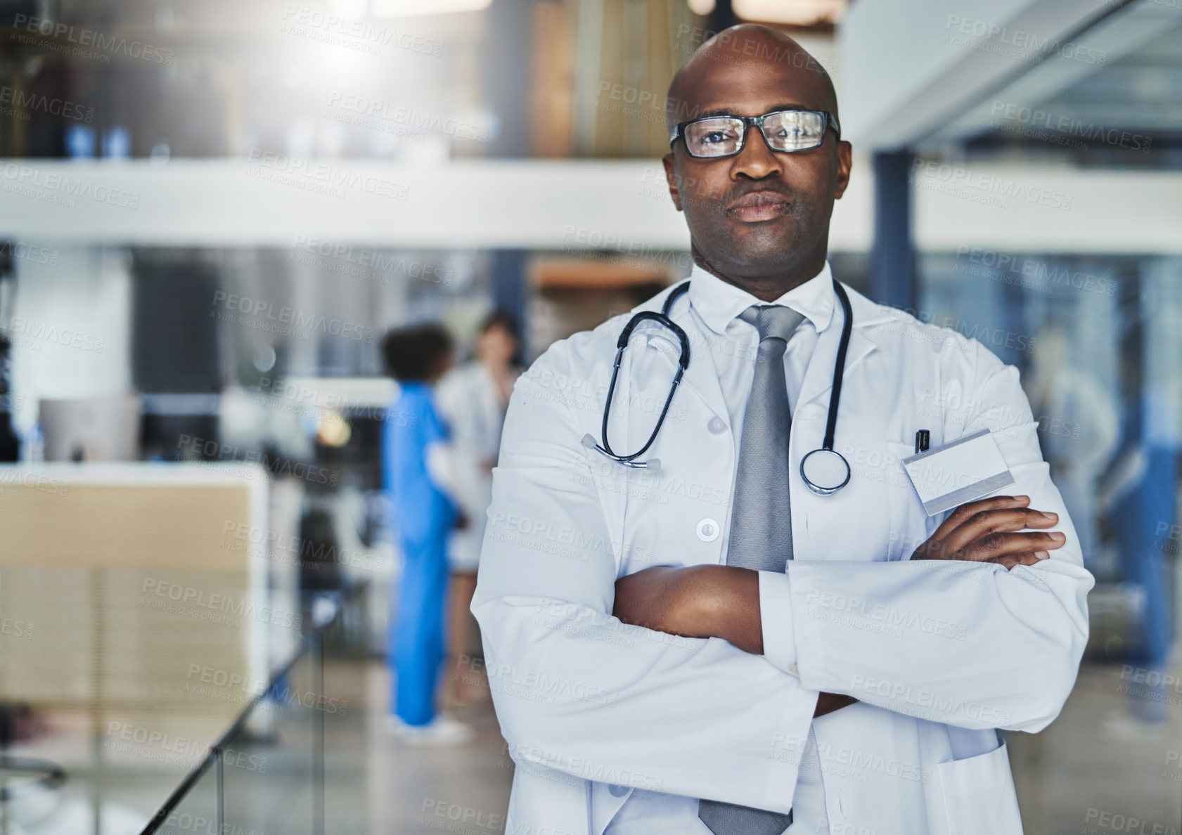 Buy stock photo Doctor, black man and confidence in hospital for healthcare, wellness or medical experience with stethoscope. Serious, portrait and pride in health facility with crossed arms for cardiology medicine