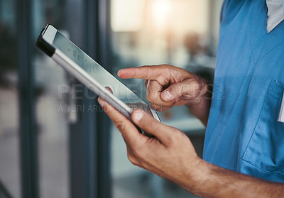 Buy stock photo Cropped shot of an unrecognizable male medical practitioner working in a hospital