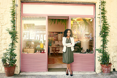 Buy stock photo Shot of a shoe shop owner standing in front of her shop