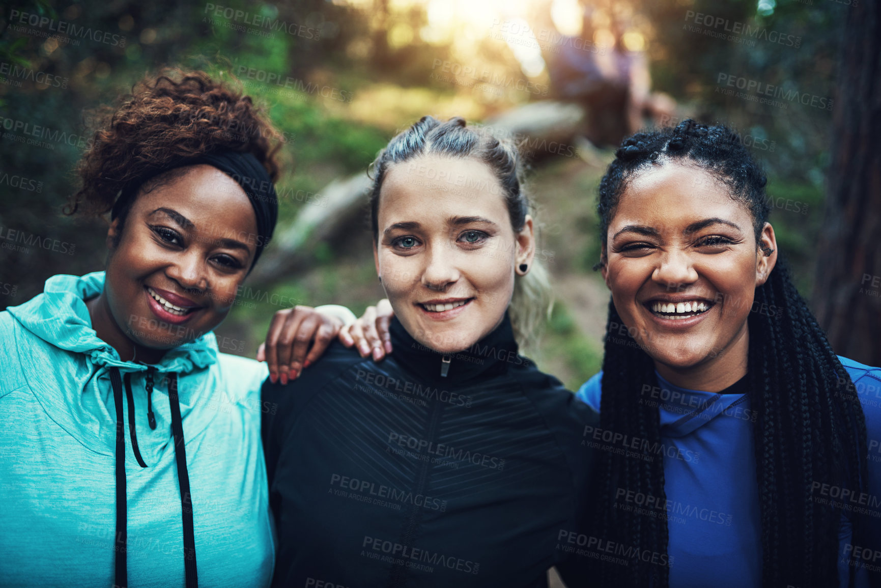 Buy stock photo Portrait of sporty young women working out in the forest