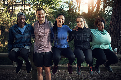 Buy stock photo Portrait of a group of sporty young friends working out in the forest