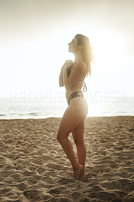 Buy stock photo Shot of a gorgeous young woman on the beach
