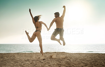 Buy stock photo Holding hands, excited and couple at sea jump with love on vacation, adventure or holiday for valentines day. Yes, engagement or people bonding together for joy at beach for romantic trip on island