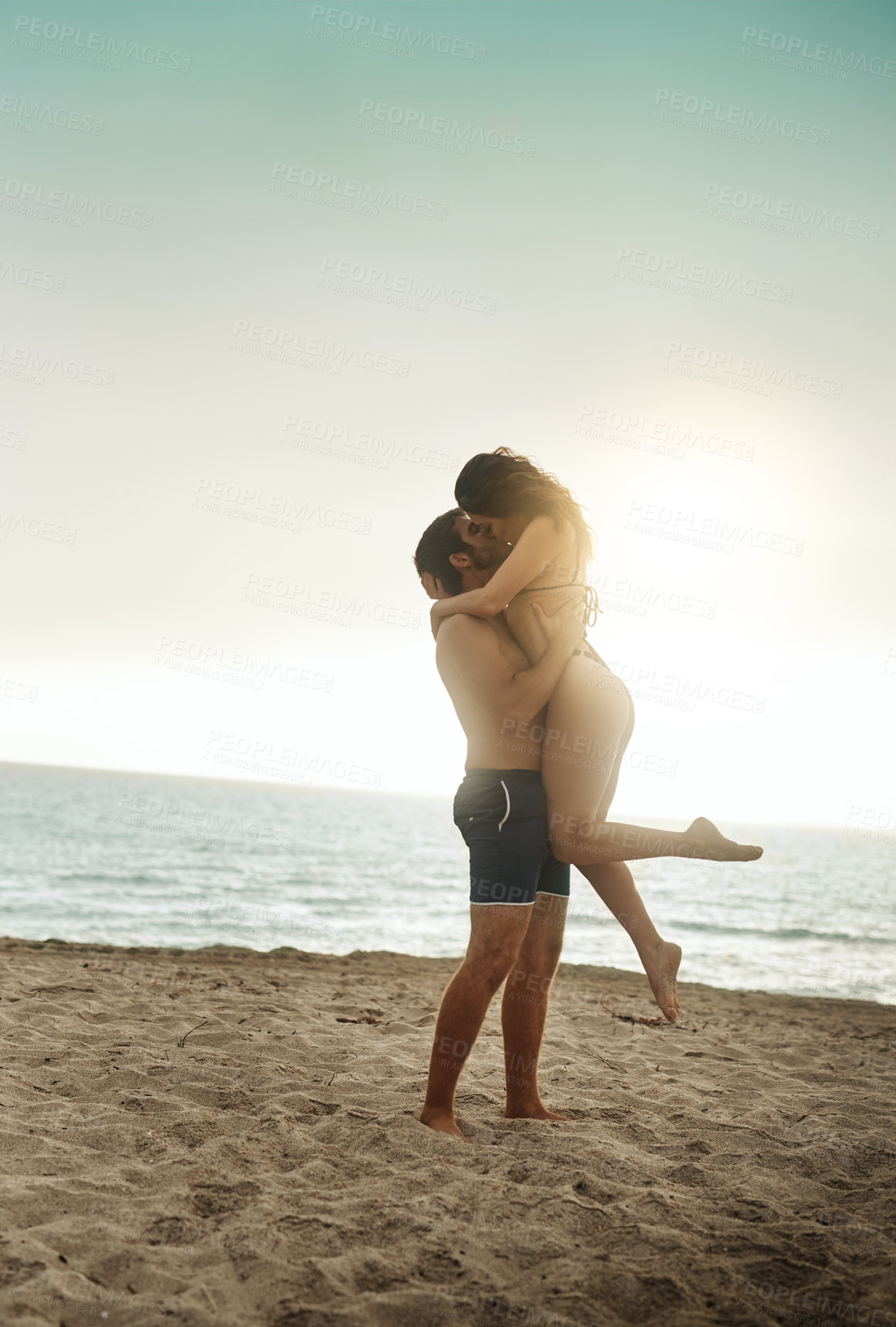 Buy stock photo Care, lifting and couple at beach with hug on vacation, adventure or holiday for valentines day. Intimate, love or man with embrace for bonding together or woman by ocean for romantic trip on island