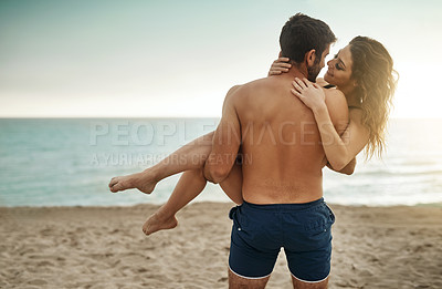 Buy stock photo Carry, romance or couple at beach with love and support on vacation, valentines day or holiday. Lifting, care or man with embrace or woman for bonding together by ocean for honeymoon trip on island