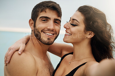 Buy stock photo Cropped shot of an affectionate  couple spending the day at the beach