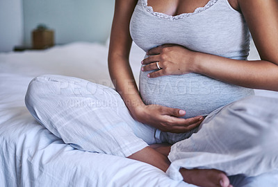 Buy stock photo Shot of an expectant woman at home