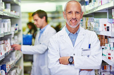 Buy stock photo Portrait of a confident mature pharmacist working in a pharmacy