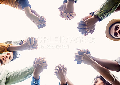Buy stock photo Cropped shot of a group of friends holding hands