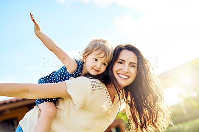 Buy stock photo Shot of a mother bonding with her adorable little daughter outdoors