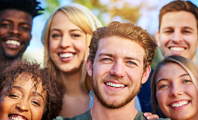 Buy stock photo Portrait of a group of students hanging out together outside on campus
