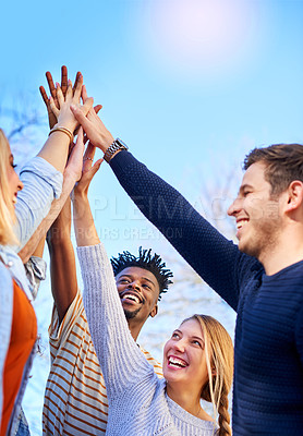 Buy stock photo Cropped shot of university students standing outside with their hands together