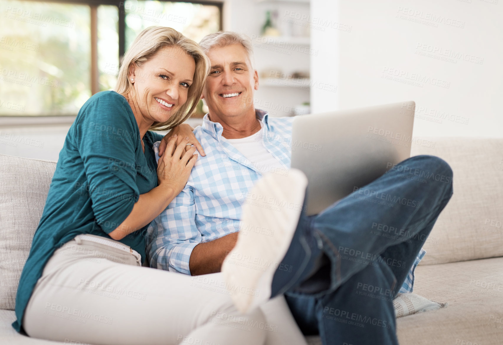 Buy stock photo Couple, couch and laptop with portrait in home, streaming and relax in living room for movies. Internet, computer and point for website for video with married people, calm and lounge with technology