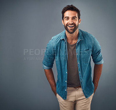 Buy stock photo Portrait, mockup and man with a smile, fashion and confident guy against a grey studio background. Face, male person and model with happiness, casual outfit and laugh with clothes, relax and funny