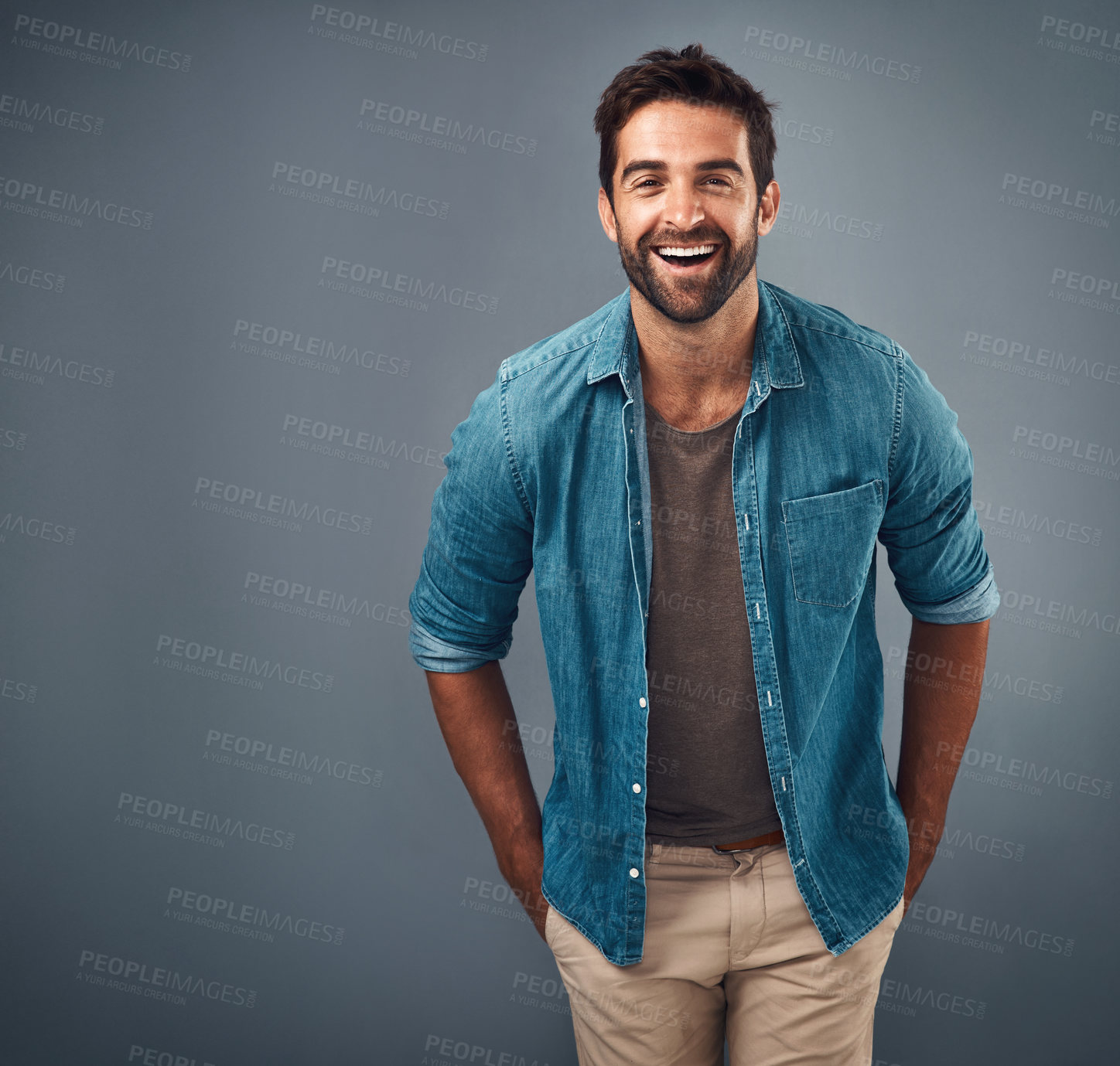Buy stock photo Portrait, mockup and man with a smile, fashion and confident guy against a grey studio background. Face, male person and model with happiness, casual outfit and laugh with clothes, relax and funny