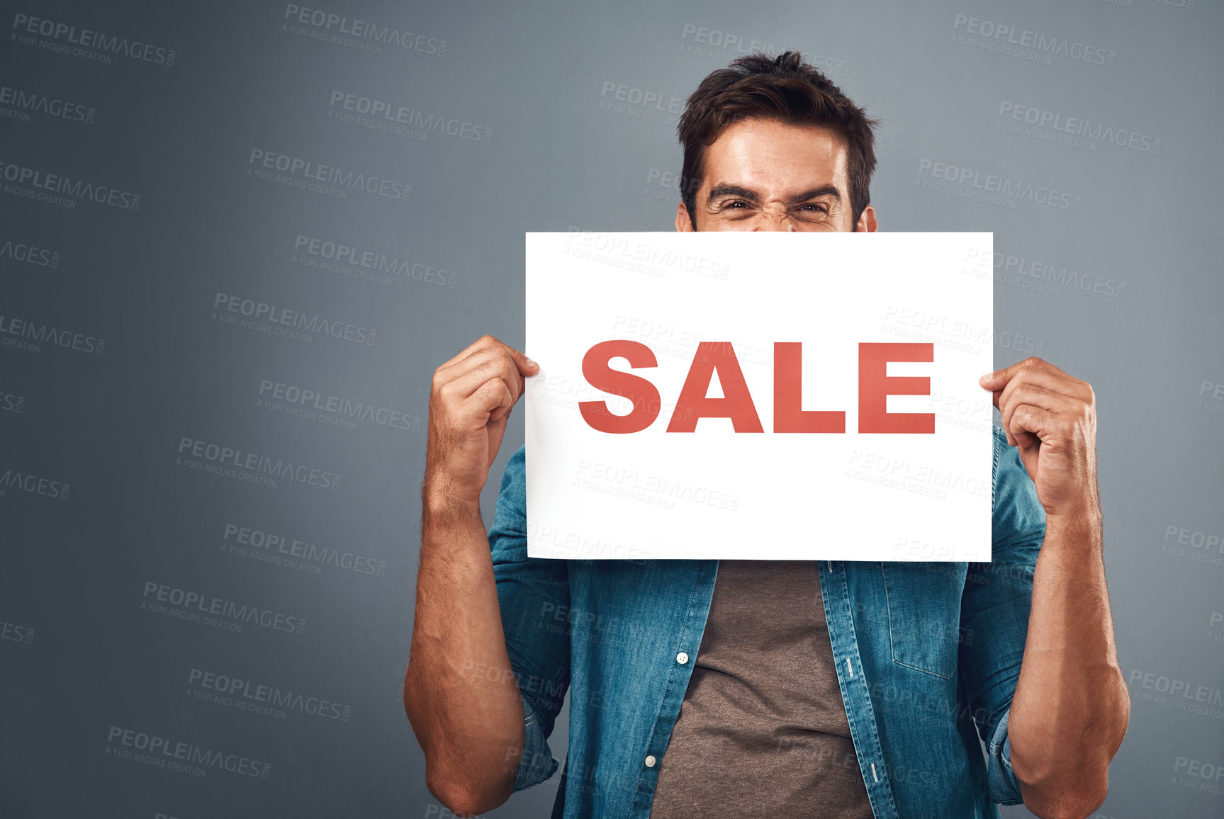 Buy stock photo Man, sale and billboard poster for advertising, marketing or branding against a grey studio background. Male person or realtor holding board or sign for sales announcement, notice or advertisement