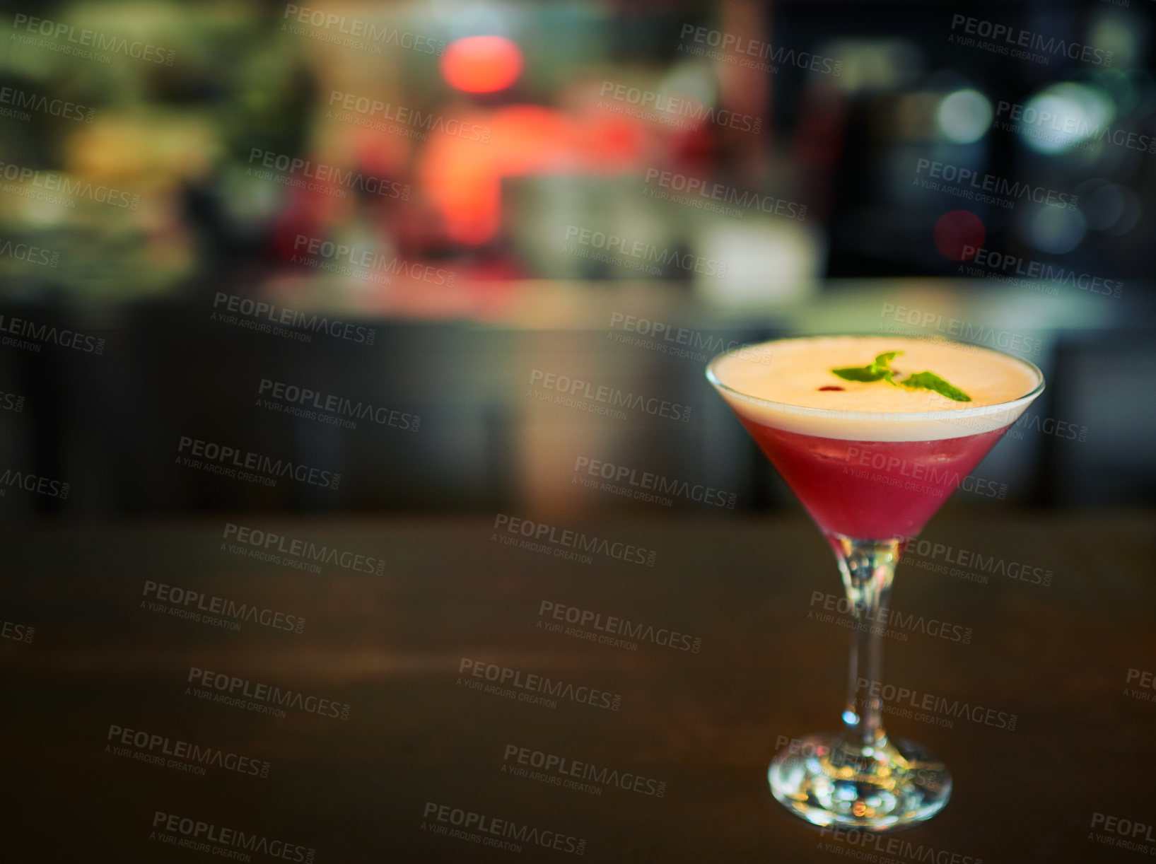 Buy stock photo Closeup of a freshly made cocktail standing on it's own on a bar counter inside of a restaurant during the day