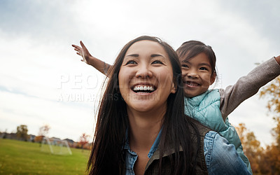 Buy stock photo Woman, smile and piggyback daughter in autumn for bonding, love and happiness together in nature. Mother, child and asian family at garden with back ride for fun, freedom and playing together outdoor