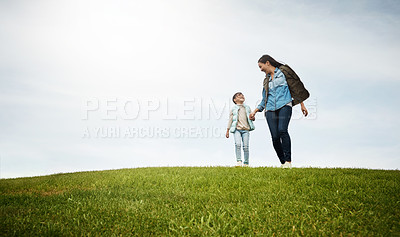 Buy stock photo Shot of an attractive young woman and her daughter in the park