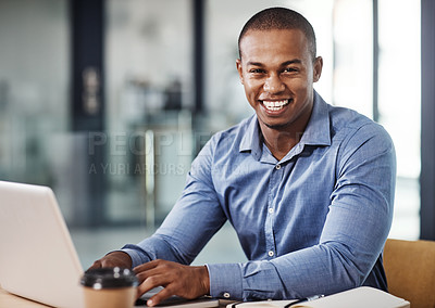 Buy stock photo Portrait of a handsome young businessman working in his office