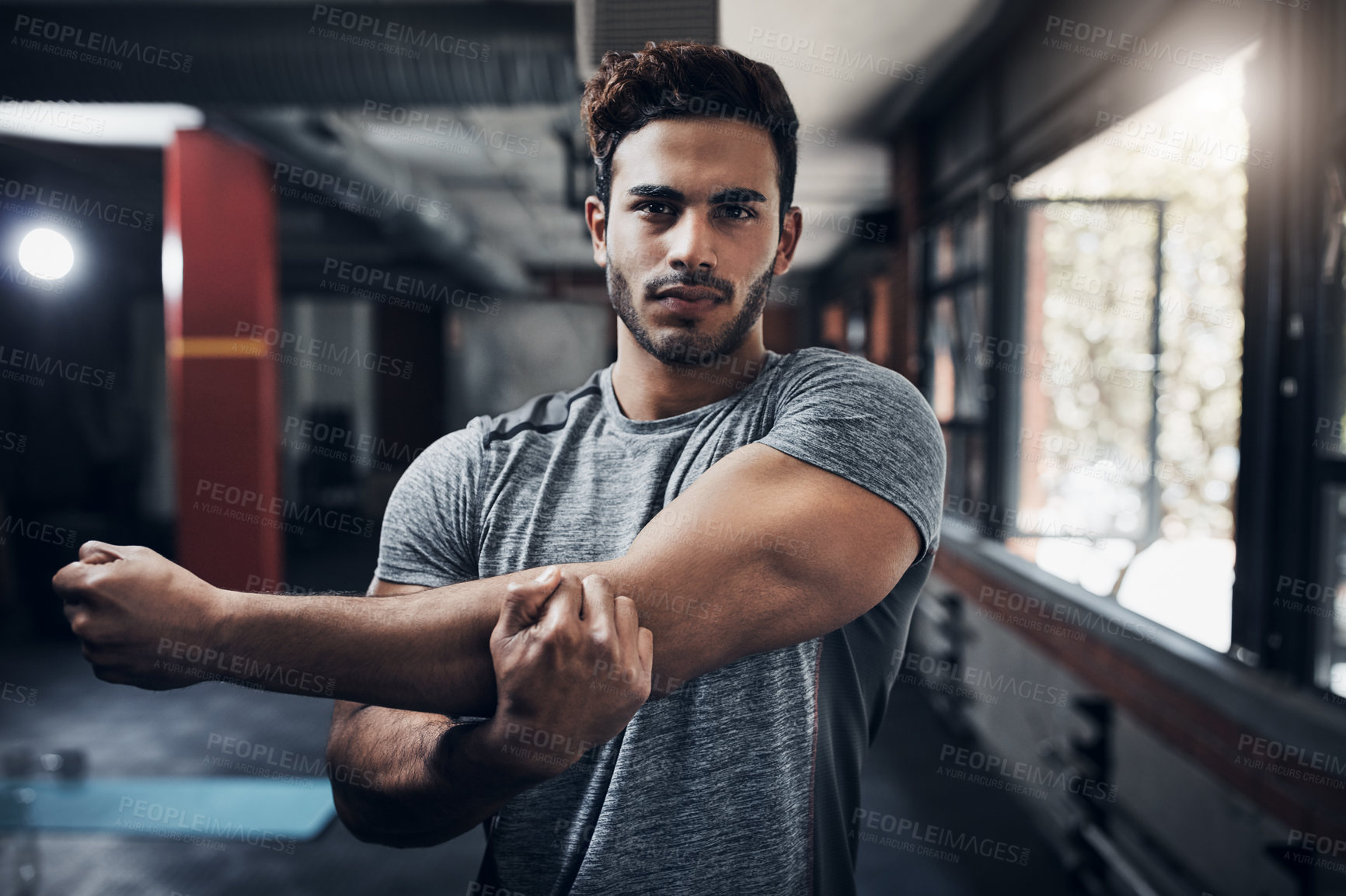 Buy stock photo Portrait of a handsome young man at the gym for a workout