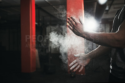 Buy stock photo Cropped shot of an unrecognizable man dusting his hands with talcum powder