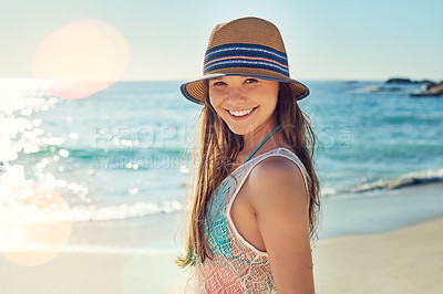 Buy stock photo Portrait of a beautiful young woman spending the day at the beach